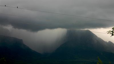 A cloudburst over Delhi, the kind of intense cell a below-normal July can still produce.