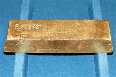 Gold bullion, the asset whose correction this piece examines.