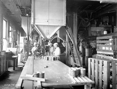 Workers on a manufacturing line. GVA measures what production adds before taxes and subsidies.