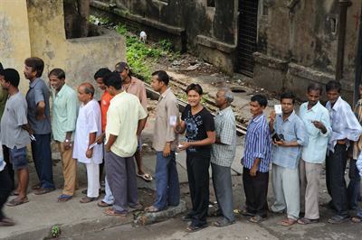 A queue of voters in India. The revision concerns who is on the roll.
