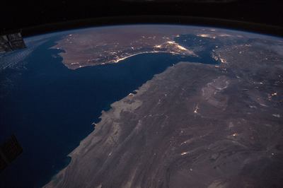 The Gulf of Oman and the Strait of Hormuz photographed from the International Space Station at night.