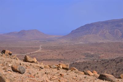 Barren volcanic terrain, of the kind the Bab el-Mandeb approaches run through.